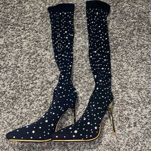 Elegant black thigh-high boots with sparkling rhinestones